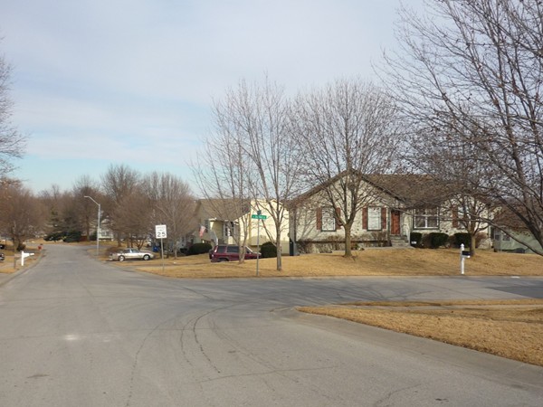 The intersection of East 2nd Street and East 3rd Terrace in the Three Trails Subdivision