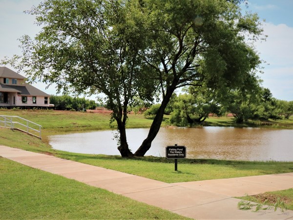 Fishing pond in The Waters is surrounded by walking trails 