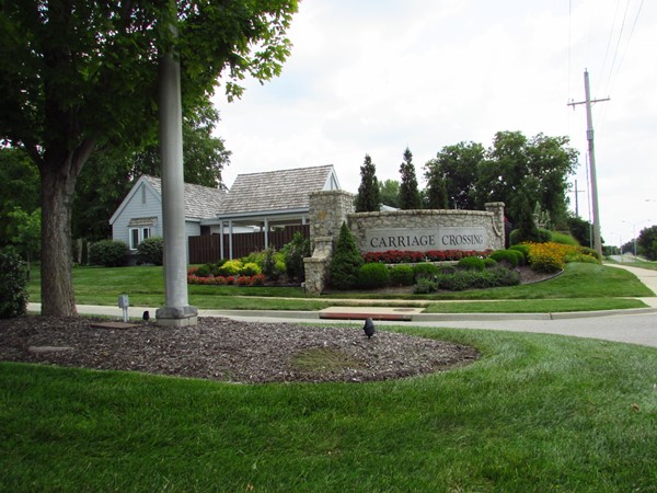 Carriage Crossing entrance and pool with clubhouse on Nall Avenue