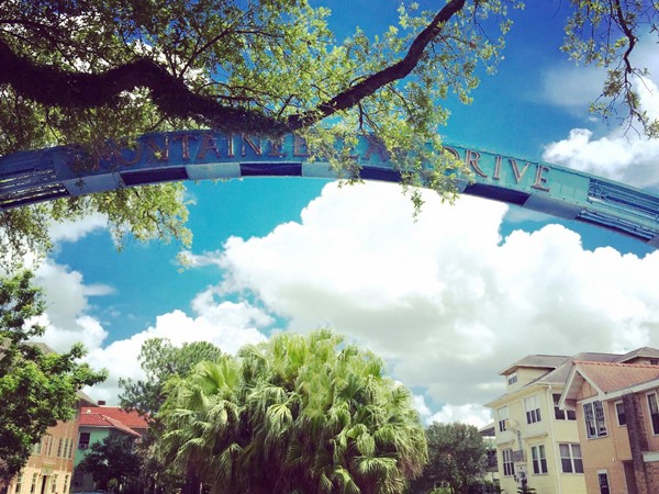 The landmark blue archway at the entrance to tree-lined Fontainebleau Drive 