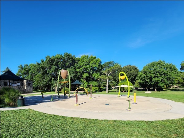 Splash pad that is situated between two playgrounds