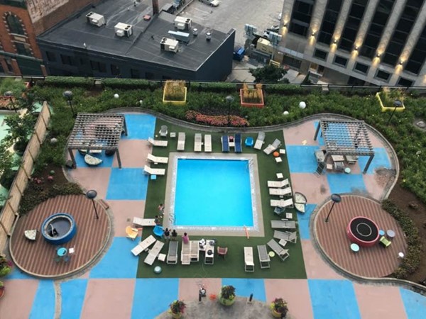 What a view of the pool and bar at Detroit City Club Apartments in the heart of Downtown Detroit