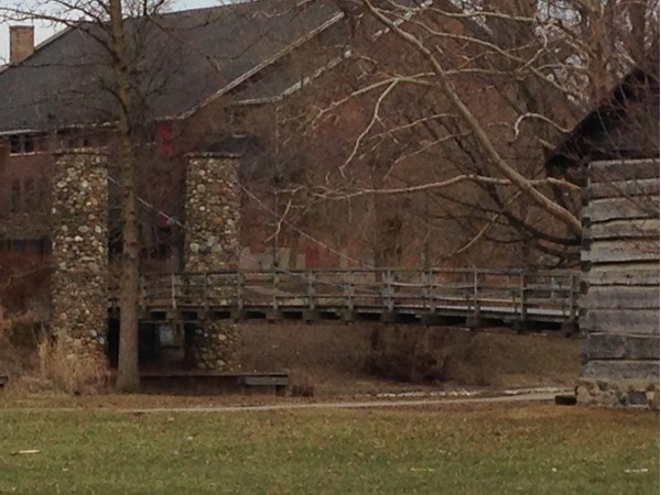 A foot bridge takes folks across the Shiawassee River from Curwood Park to the junior high