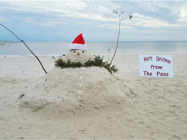 Festive snowman on the beach in Pass Christian