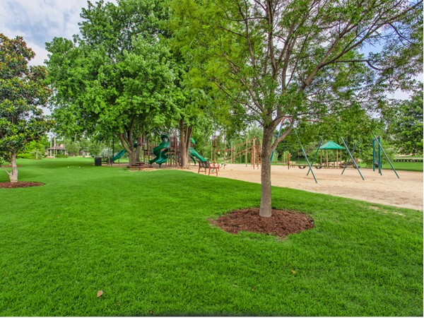 The serene setting of Kite Park in Nichols Hills offers a large playground for children to play