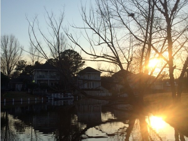 Enjoy serene sunset views from you back porch overlooking the beautiful lake in Lakeshore