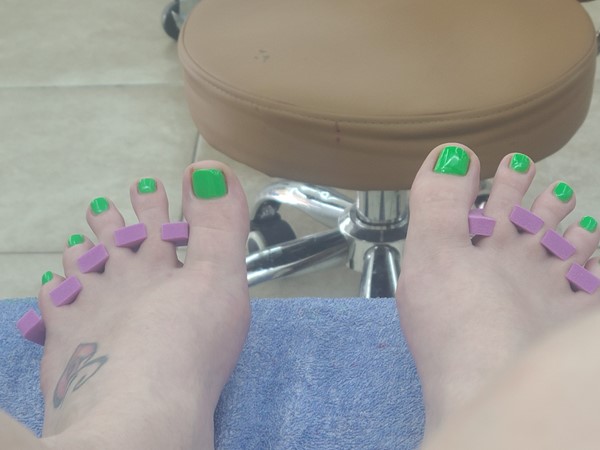 Getting my pedicure done at Deluxe Nails before our family reunion 