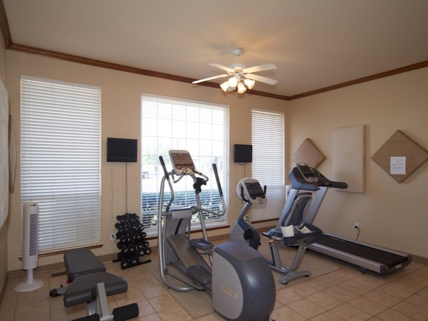 The clubhouse includes a workout area with updated equipment
