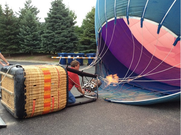 RE/MAX balloonist inflating balloon for Maytag Ironman event