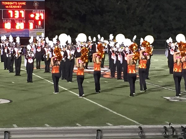 Platte County Dance Team performs at a Friday night football game with the Platte Co Traditions band