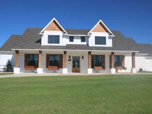 Check out the clubhouse with a farm house style exterior