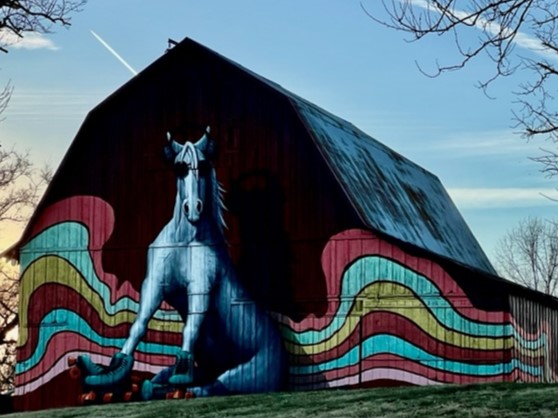 Mural painted by two local artist adds a fun-loving look to this hilltop barn 