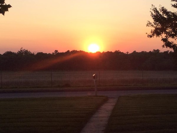 Beautiful sunsets can be enjoyed over the pasture from several porches throughout the neighborhood.