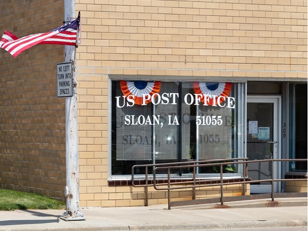 The US Post Office in Sloan proudly displays the American Flag