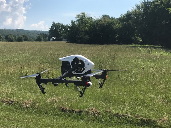 Team drone in the mountain meadows ready for take off