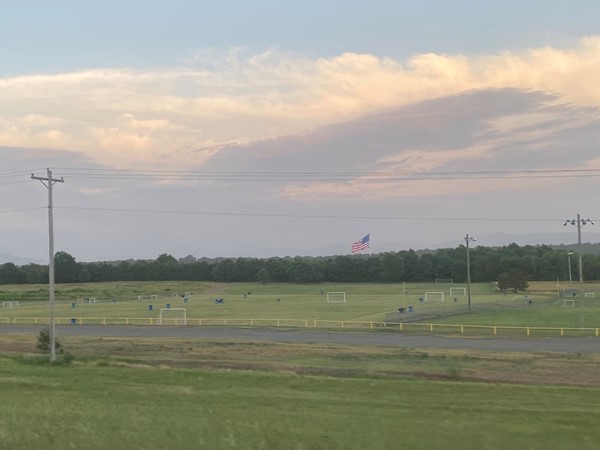 Beautiful sky and the flag is flying high at Poteau Area Recreational Complex  