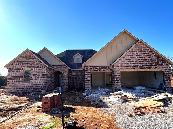 New home under construction on a .51 acre lot with 4 beds 3 baths