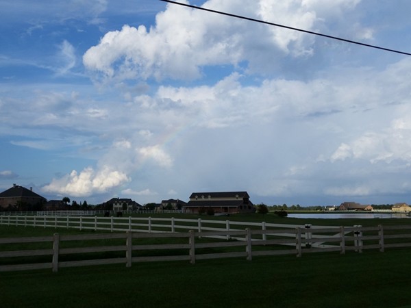 Rainbow over the ranch-like properties at Mallard Lakes subdivision