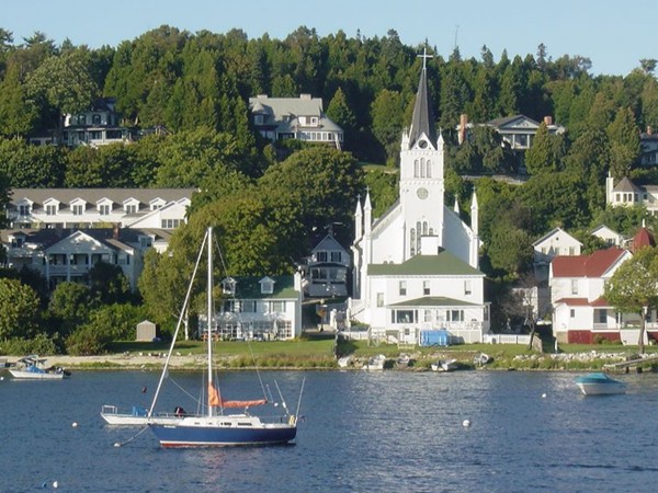 A boat deck view of the historic buildings of Mackinac Island