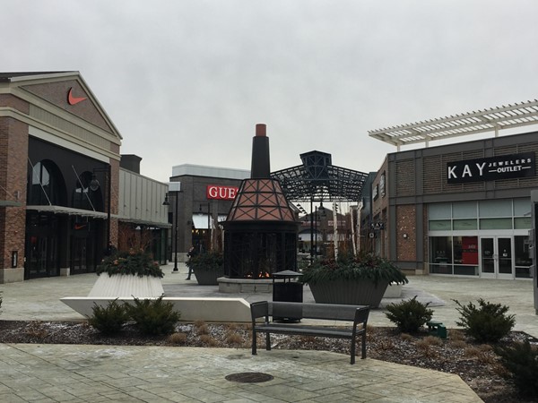 Although it's winter, you can still shop outside and cozy up to Tanger Outlets' outdoor fireplace