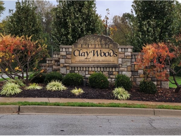 Beautiful fall colors surround the Clay Woods entrance sign