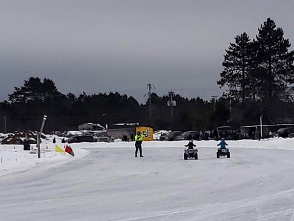 A fight for first at the Upper Michigan Ice Racing Track located in Gwinn