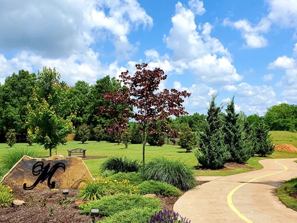 Exquisite & easy access to the Razorback Greenway Trails at the entrance of the Manors 