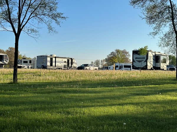 Campers lined up along the lake ready for the summer at Big Woods Lake Campground