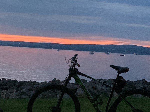 Glorious sunset looking from Petoskey towards Harbor Springs. The bike trail brings us together!