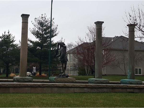 Pillars surrounding a statue of a girl in Saddleridge 