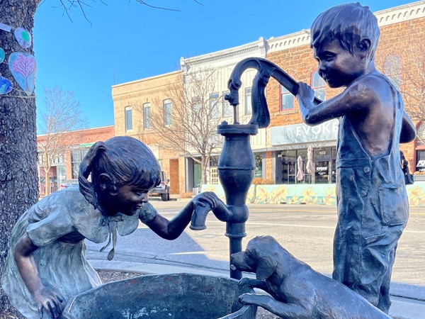 Adorable bronze statue located in Downtown Edmond 