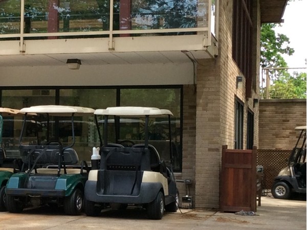 Golf carts in front of the Grand Beach Municipal Golf Course