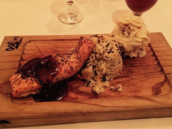Try Salmon with Whiskey Maple Sauce and potatoes at The Ivory Grille