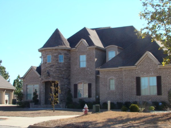 Turtle Creek homes are all custom!  Look at this lovely stacked stone tower!