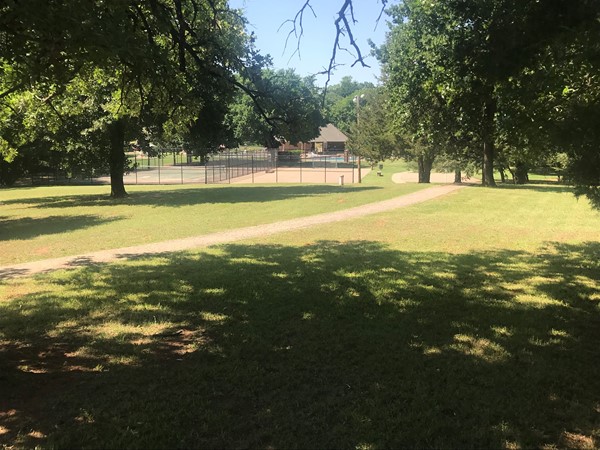 Large green belt area with trail and picnic table, your own community park has it all