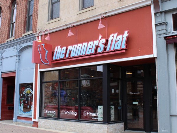 Best place to buy running shoes is at The Runner's Flat" downtown on Main Street