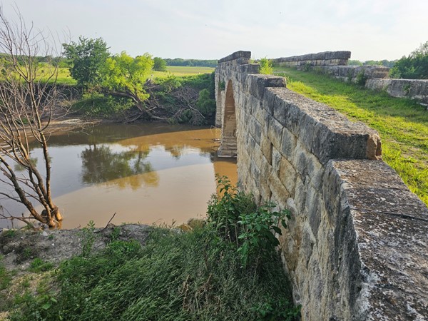 The craftsmanship of 1886 still stands strong—Clements Bridge arches over the Cottonwood with grace